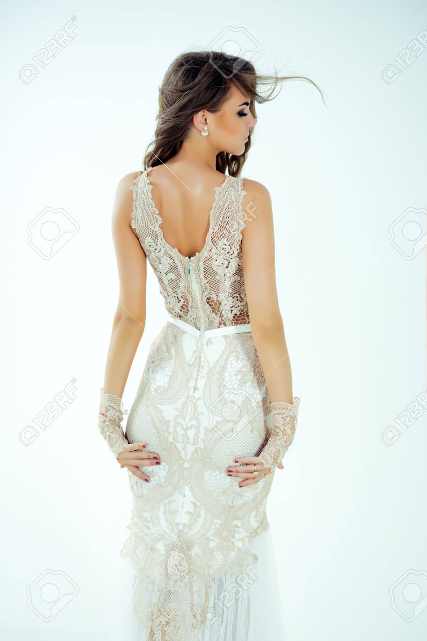 Woman Posing In Evening Dress, Back View. Model With Stylish 