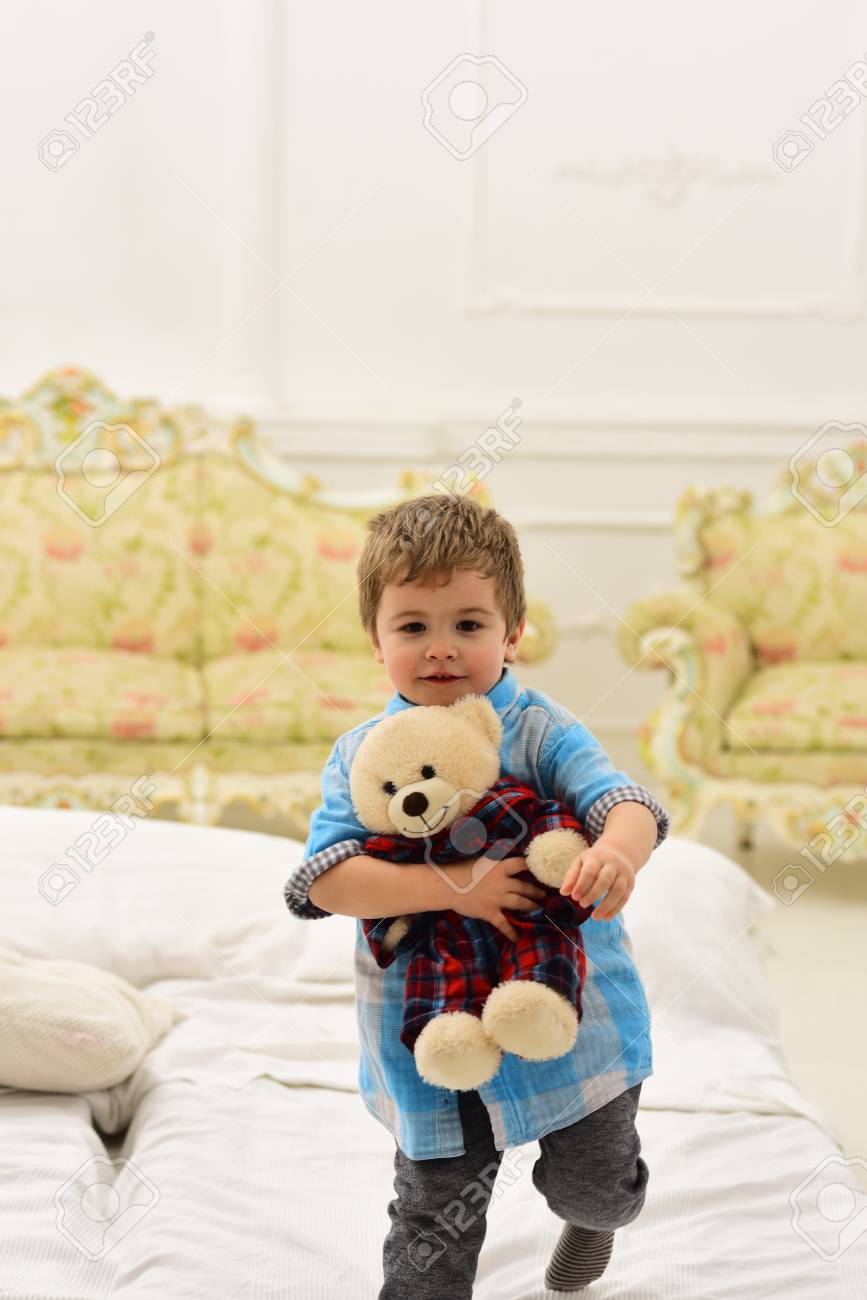 child with teddy bear