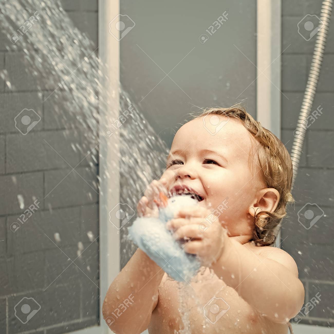 Smiling Child In Shower Stock Photo, Picture And Royalty Free Image. Image  101382047.