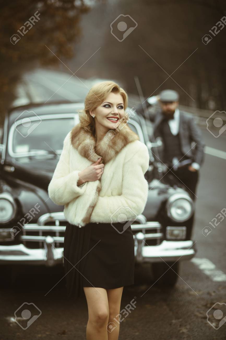 Fur coat and young escort Fur coat and young escort