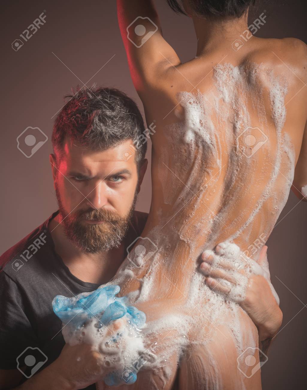 Massage And Family Spa Concept. Bearded Man Wash Naked Woman With Wisp.  Couple In Love With Sexy Body Relax In Shower. Love Relations Of Couple In  Bath With Foam. Sex Games Desire
