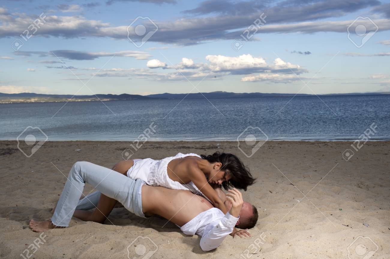 Sex On Beach Concept. Couple In Love Have Sex, Makes Love On Sand Beach pic