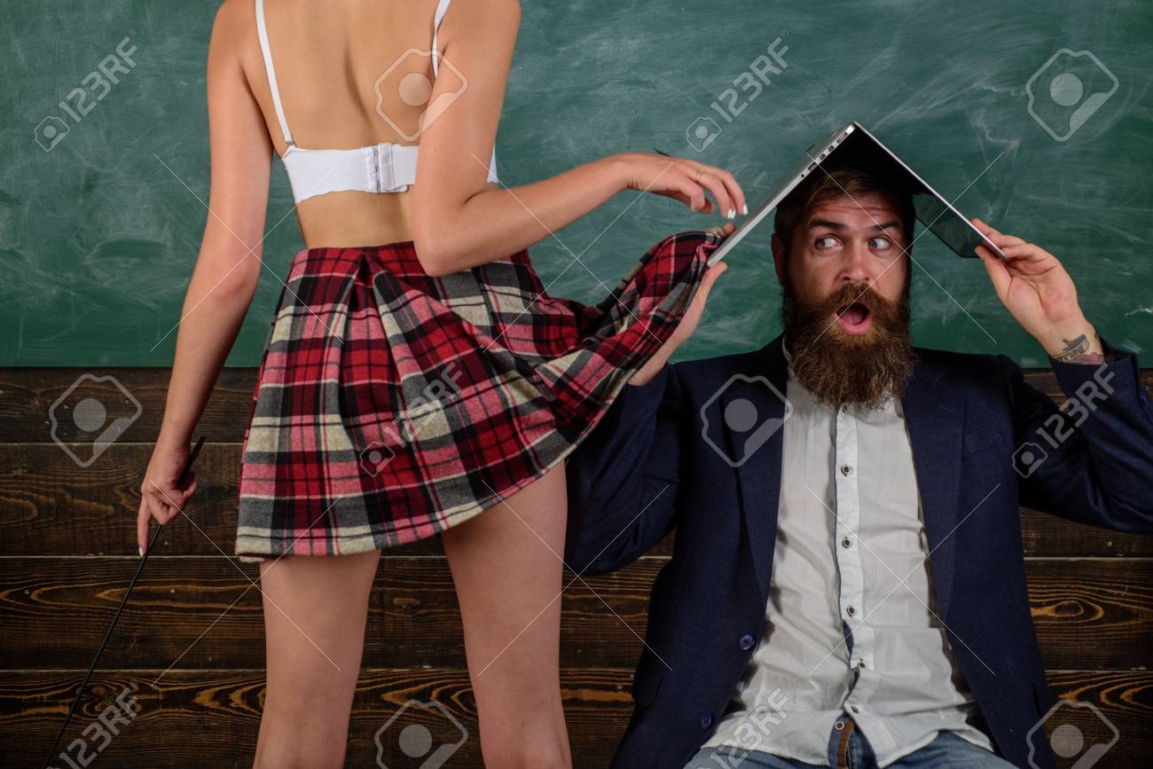 Sex Education. Guy Laptop Erotic Video. Man Experienced Bearded Teacher And  Seductive Female Sexy Buttocks. Learning Sexy Female Body. Sexual Life  Concept. Desirable Student Sexy Legs. Sex Role Game Фотография, картинки,  изображения
