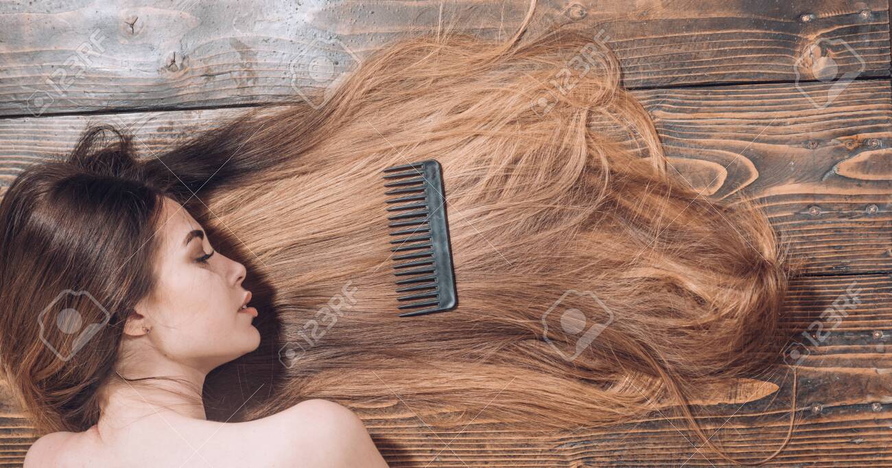 Woman With Beautiful Long Hair On Wooden Background Long Hair