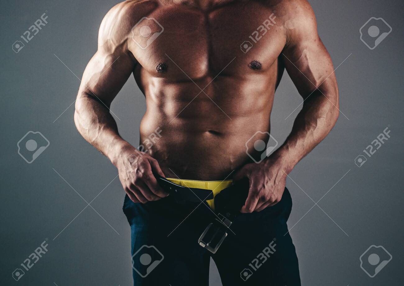 Muscular Gay Sexy With Six Pack Abs In Studio With Dramatic Lighting  Against A Dark Background. Men Abs. Fitness Abdominal Muscle. Man Six Pack.  Stock Photo, Picture And Royalty Free Image. Image