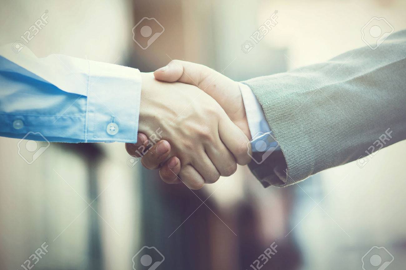 Business handshake. Two businessman shaking hands (Vintage tone) - 54745382 Business handshake. Two businessman shaking hands (Vintage tone) - 54745382
