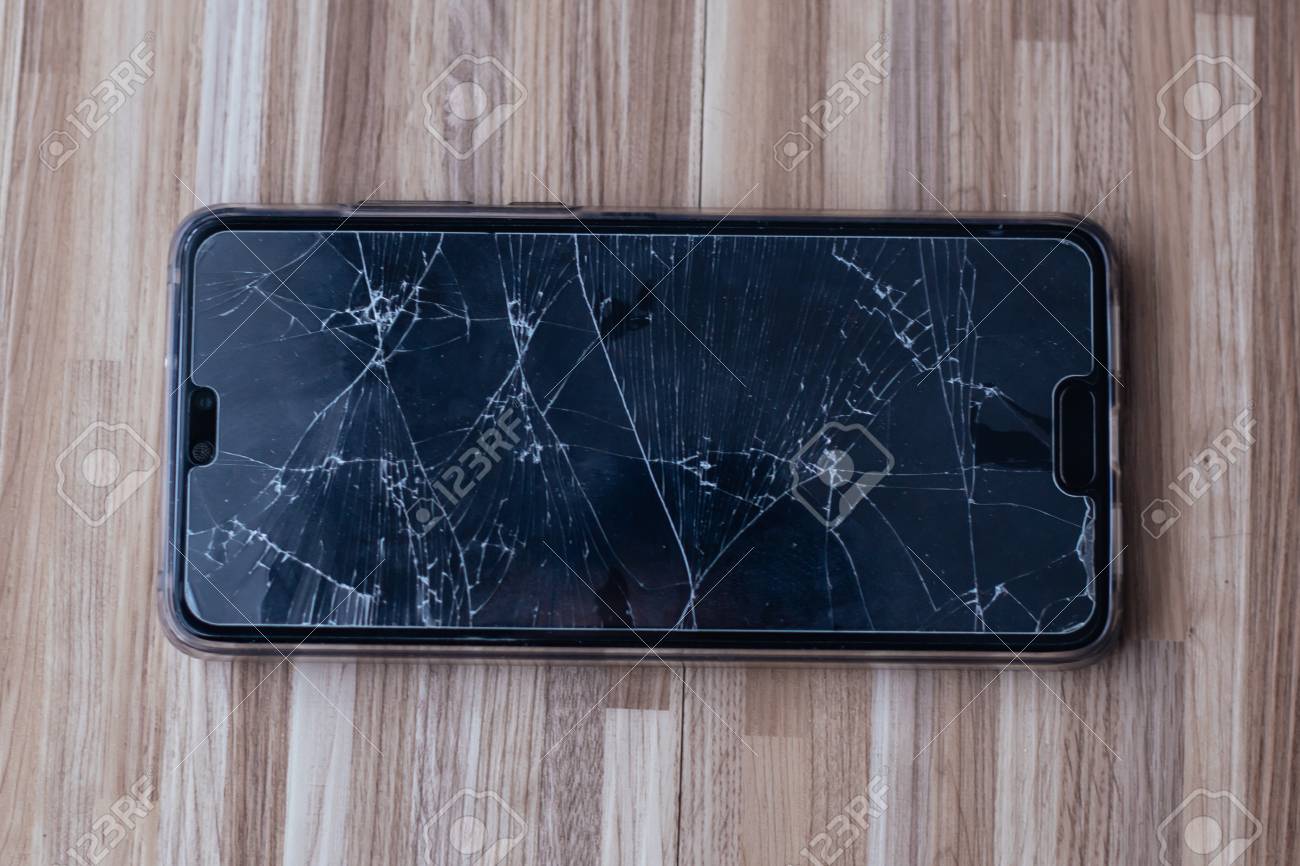 Close Up Of Broken And Damaged Glass Of Mobile Phone From Accident On Floor Stock Photo Picture And Royalty Free Image Image 111311466