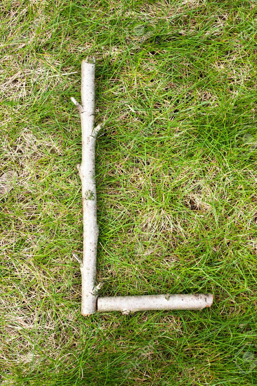 Alphabet On Green Spring Grass Made Of Wooden Sticks: Letter L Stock Photo,  Picture And Royalty Free Image. Image 74898307.