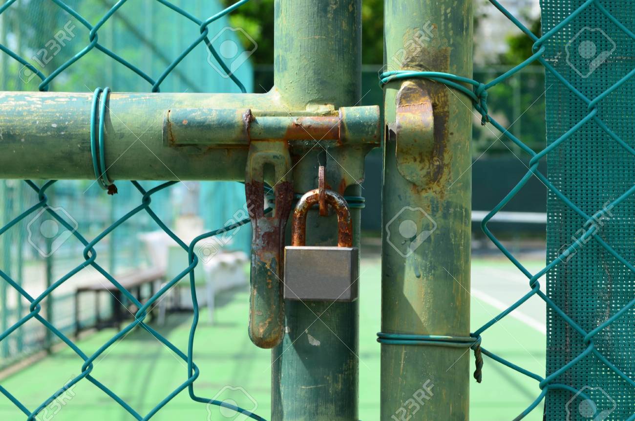 Rust Lock At Grunge Green Chain Link Metal Fence In Front Of Tennis Court  Stock Photo, Picture and Royalty Free Image. Image 70852648.