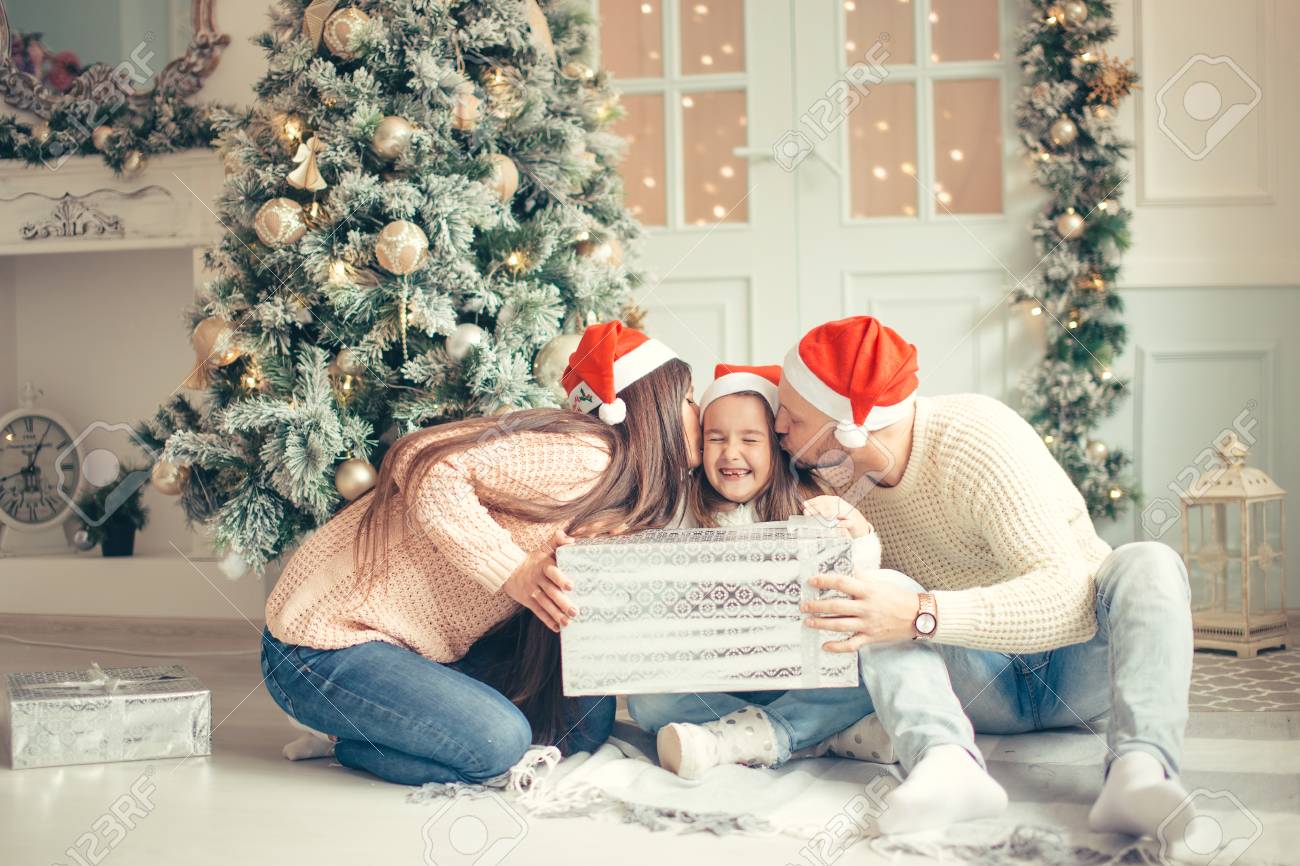 parents with little girl surprised christmas presents for the new year stock photo 90947494 - Christmas Presents For Parents parents with little girl surprised christmas presents for the new year stock photo 90947494 - Christmas Presents For Parents