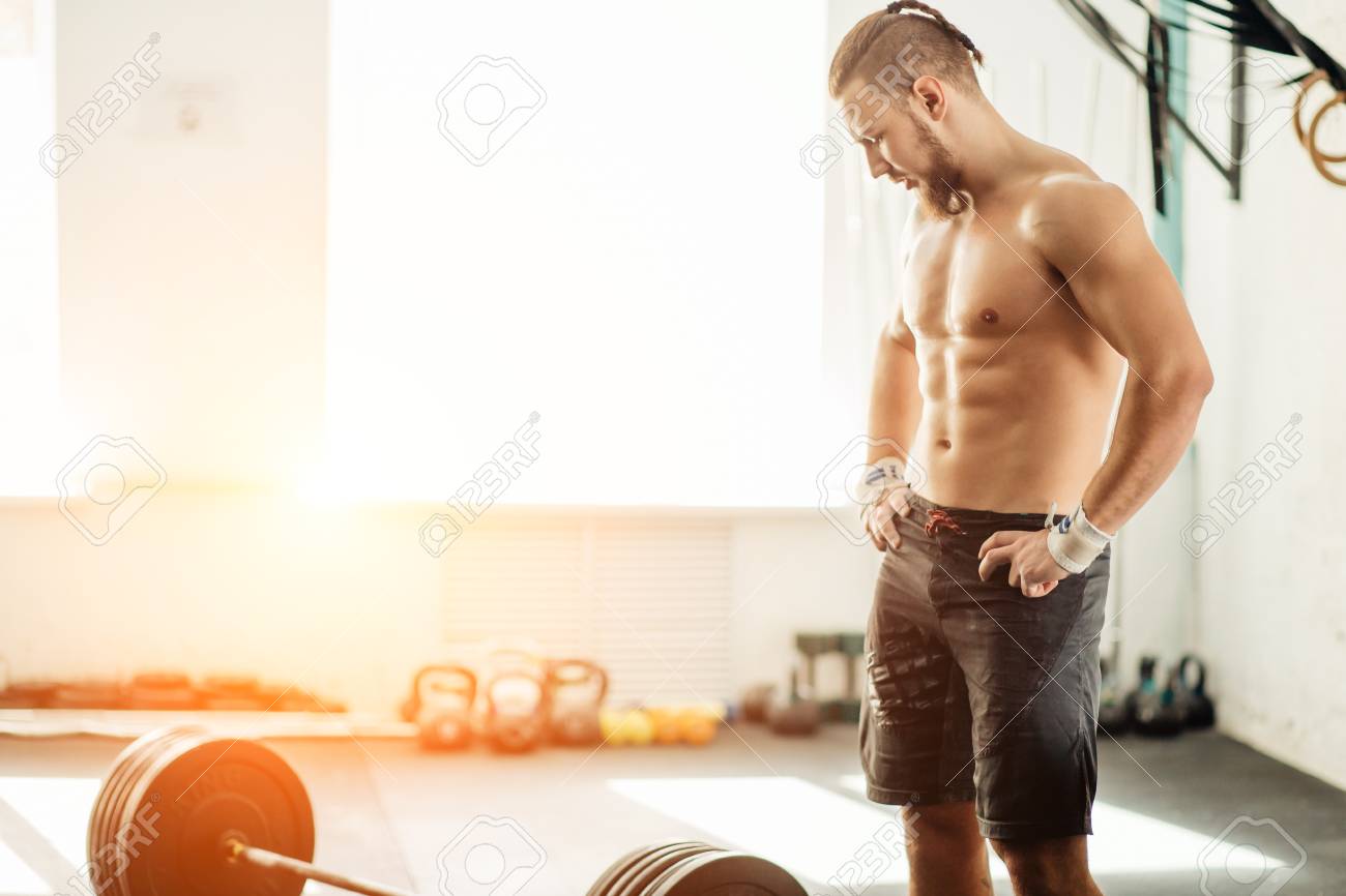 Pretty Man Tired After Weightlifting At Gym Stock Photo, Picture And Royalty Free Image. Image 91703771.