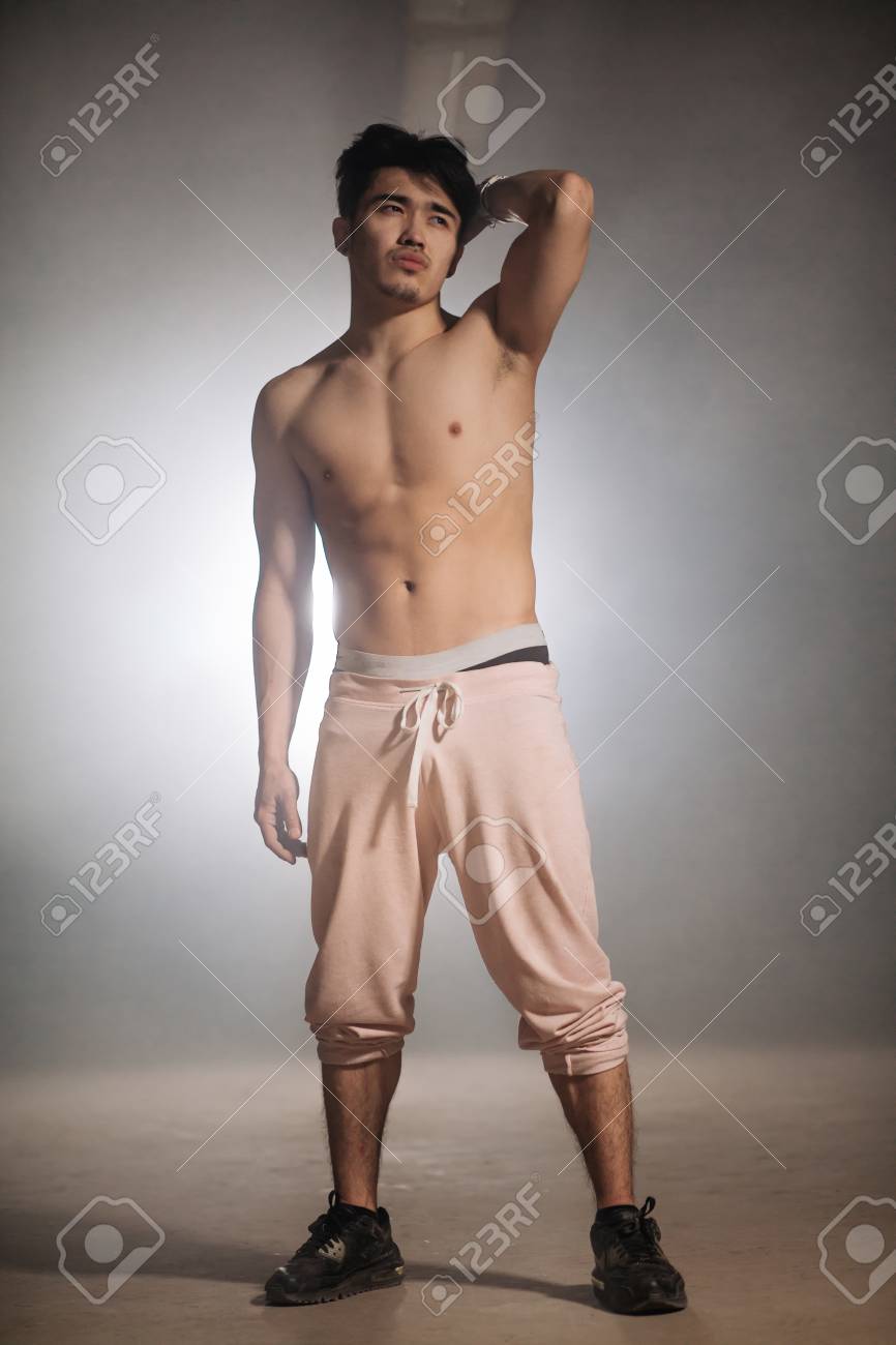 Attractive Looking Man Nacked To The Waist Is Showing His New Haircut Stock Photo Attractive Looking Man Nacked To The Waist Is Showing His New Haircut Stock Photo