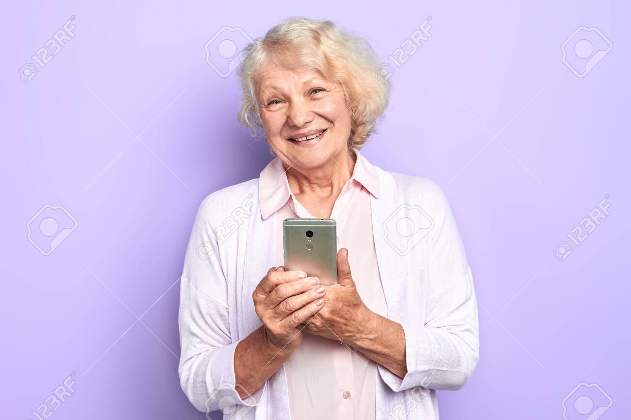 beautiful pleasant doctor browsing, surfing the net isolated light blue background. studio shot. online consultation. technology concept - 127367508 beautiful pleasant doctor browsing, surfing the net isolated light blue background. studio shot. online consultation. technology concept - 127367508