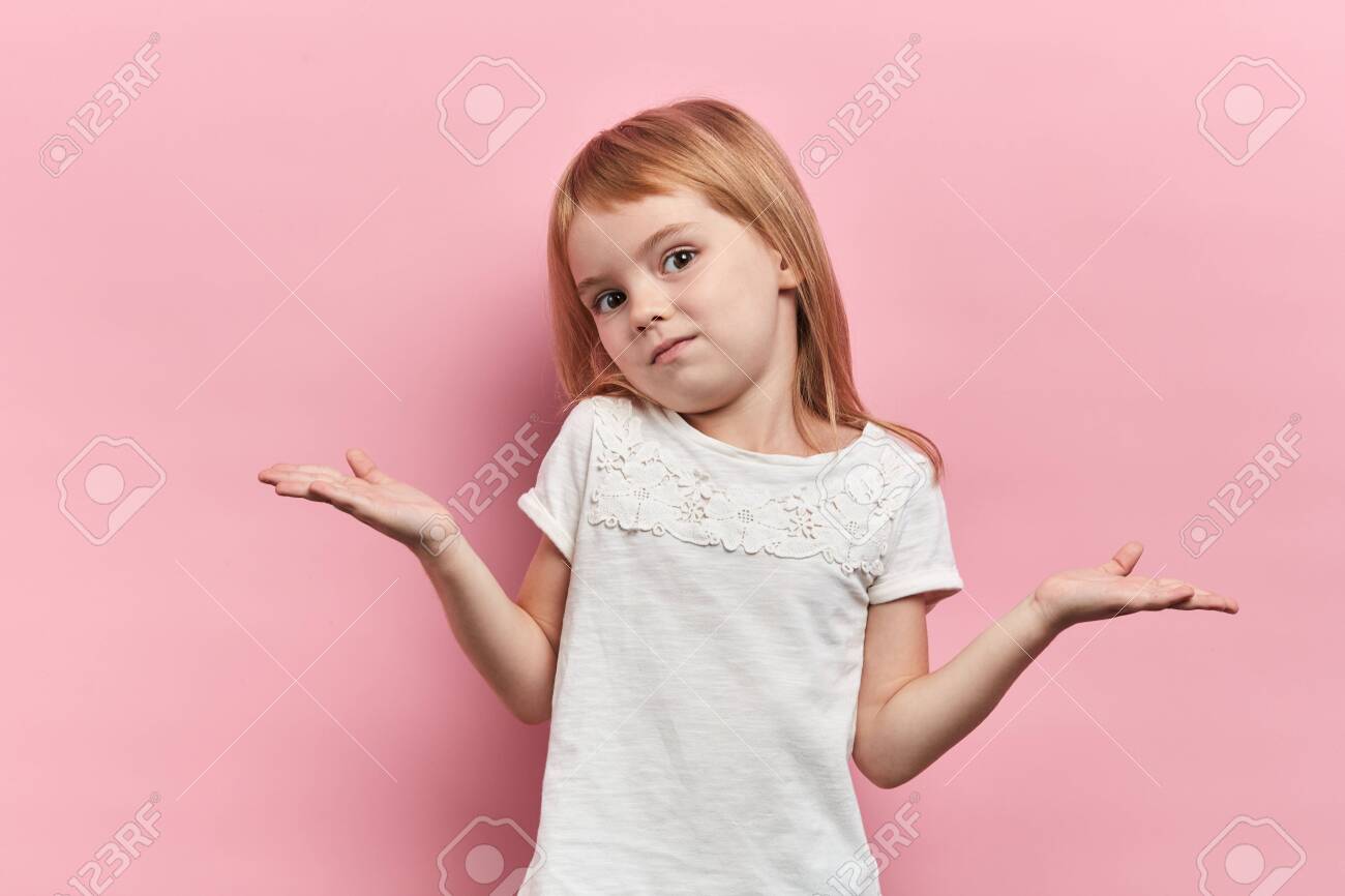 lovely beautiful girl with raised arms shrugging her shoulders, expressing her doubte, girl cannot solve a problem, answer the question, close up portrait, isolated pink background, body language - 132796404 lovely beautiful girl with raised arms shrugging her shoulders, expressing her doubte, girl cannot solve a problem, answer the question, close up portrait, isolated pink background, body language - 132796404