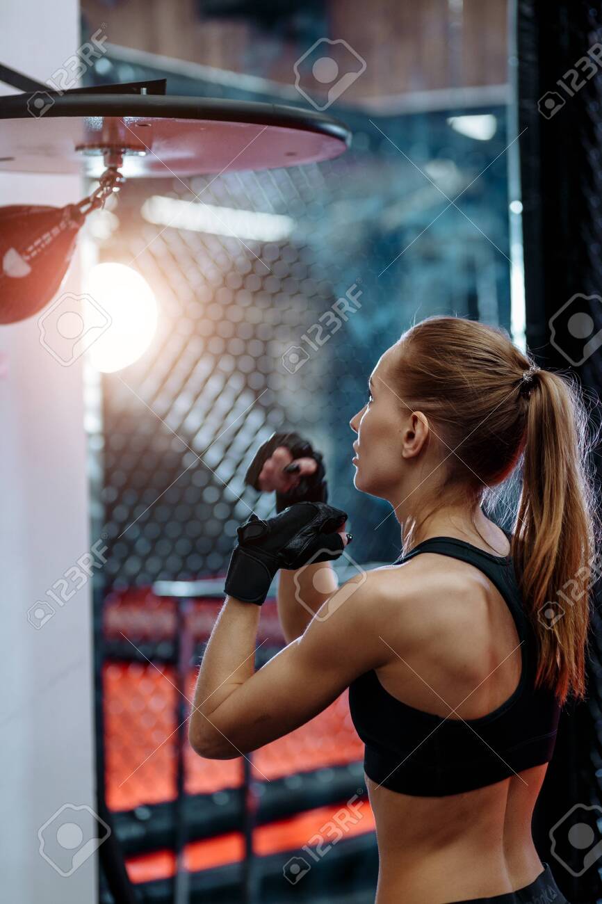 Sporty Blond Woman Training Speed Hits On Small Boxing Bag Stock Photo,  Picture and Royalty Free Image. Image 151978112.