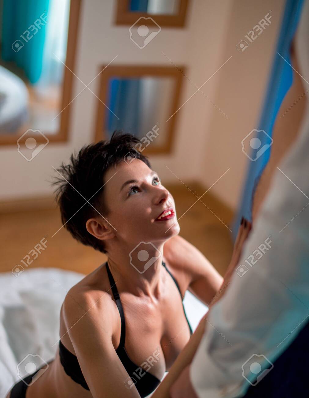 Emotional Sexy Scene Young Woman Undressing Her Partner For Blow Job Stock  Photo, Picture and Royalty Free Image. Image 155197991.