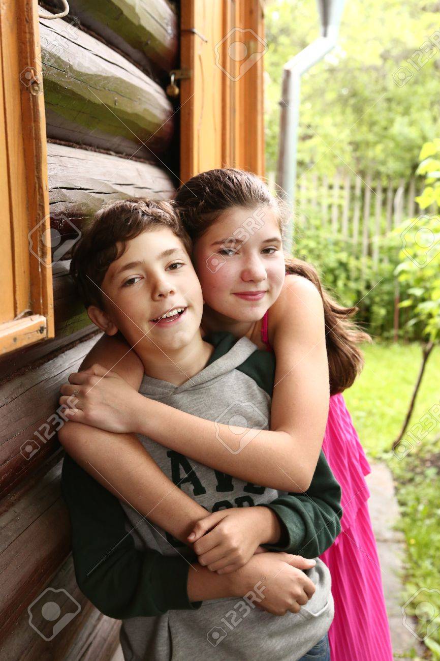 siblings couple brother and sister close up hugging portrait stock