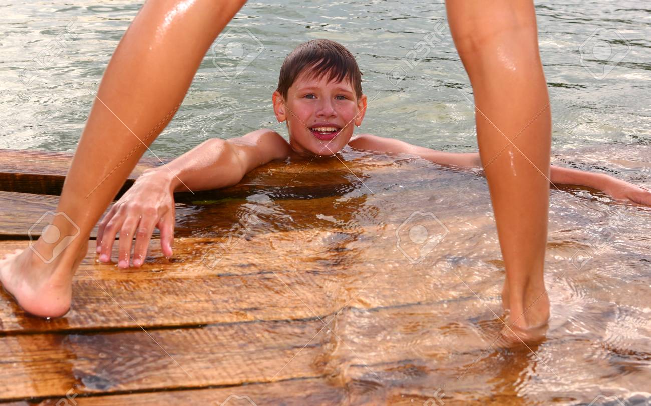 Stock Photo Teen Boys Swimming In The Lake On Hot Summer Day Close Up Photo Stock Photo Teen Boys Swimming In The Lake On Hot Summer Day Close Up Photo