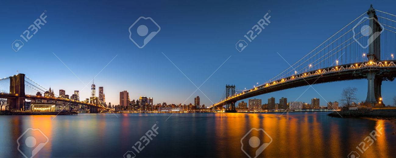 Dusk panorama with the downtown New York City skyline and the Two Bridges Brooklyn Bridge and Manhattan Bridge viewed from Brooklyn Bridge Park, across the East River - 24903684 Dusk panorama with the downtown New York City skyline and the Two Bridges Brooklyn Bridge and Manhattan Bridge viewed from Brooklyn Bridge Park, across the East River - 24903684