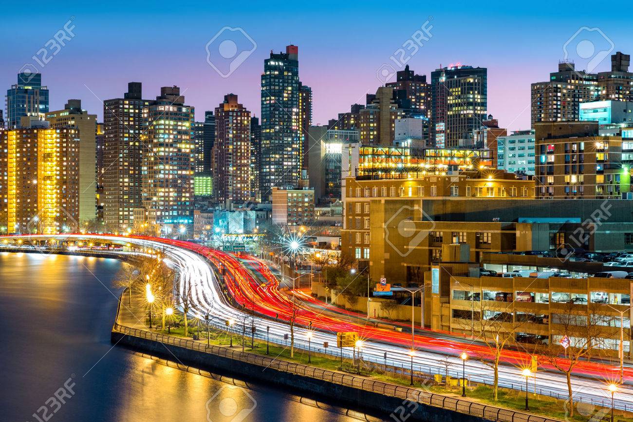 East Harlem neighborhood skyline with rush hour traffic on FDR drive, at dusk, in Manhattan, New York City - 56119681 East Harlem neighborhood skyline with rush hour traffic on FDR drive, at dusk, in Manhattan, New York City - 56119681