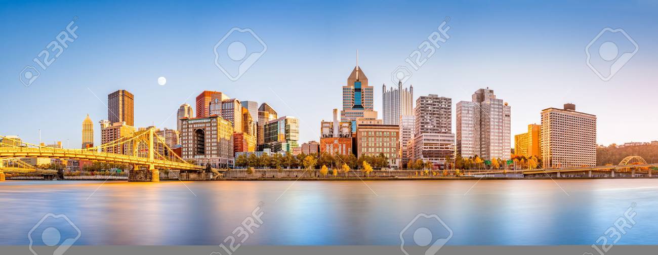 Long exposure of Pittsburgh downtown skyline and Roberto Clemente bridge, on a sunny afternoon, as viewed from North Shore Riverfront Park, across Allegheny River. - 67161982 Long exposure of Pittsburgh downtown skyline and Roberto Clemente bridge, on a sunny afternoon, as viewed from North Shore Riverfront Park, across Allegheny River. - 67161982