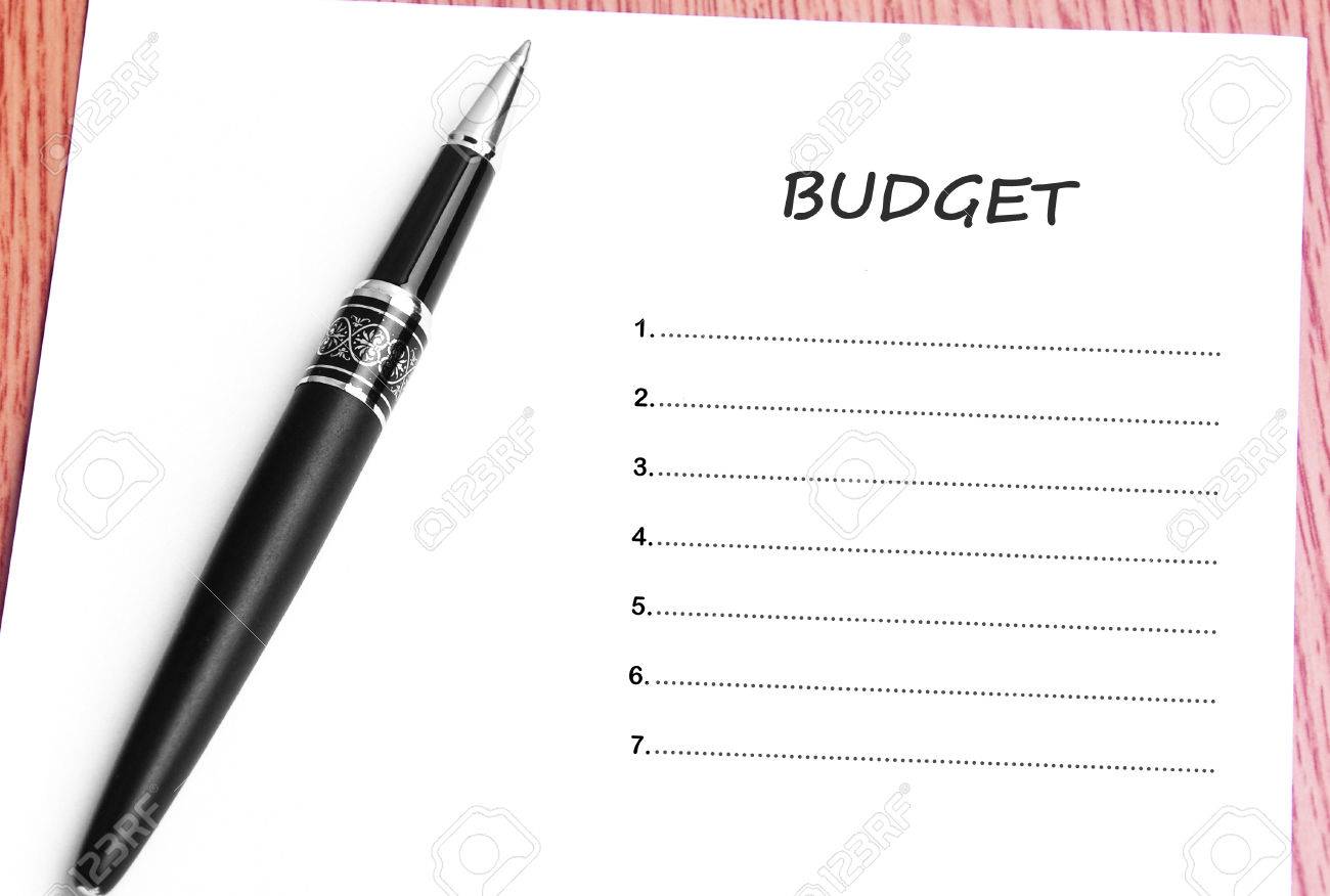 Pen And Notes Paper With Budget List Stock Photo Picture And