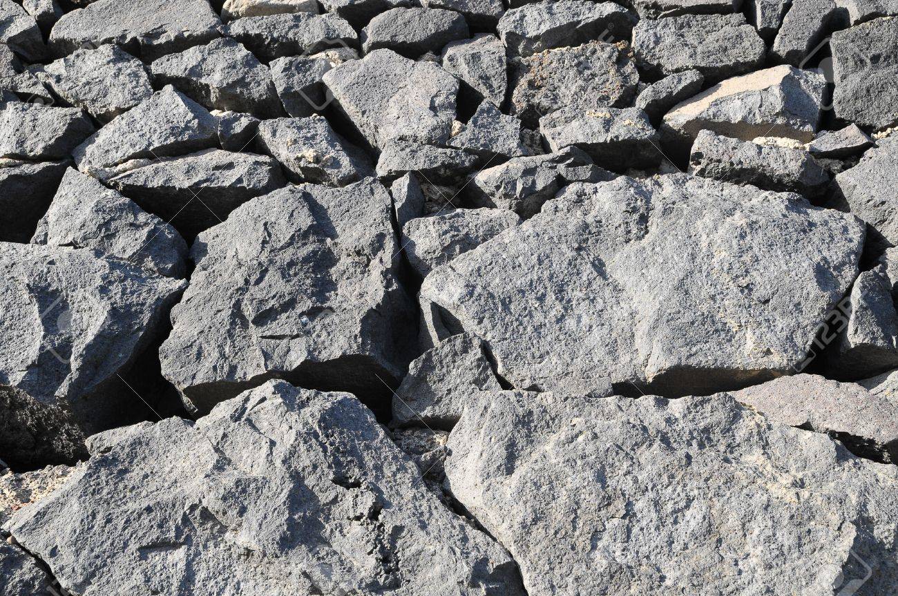 textura gris de la roca antigua pared de rocas volcánicas fotos