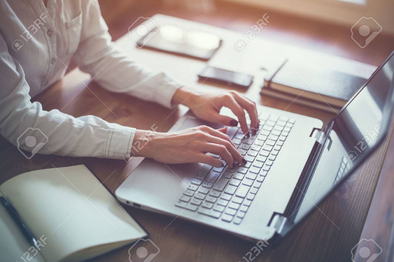 female working with laptop at home woman s hands on notebook stock