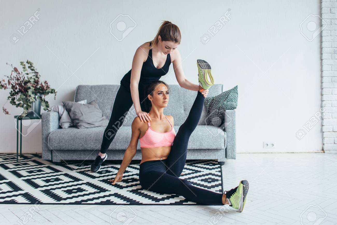 Zaripov AndreiFit Woman Doing Stretching Exercises