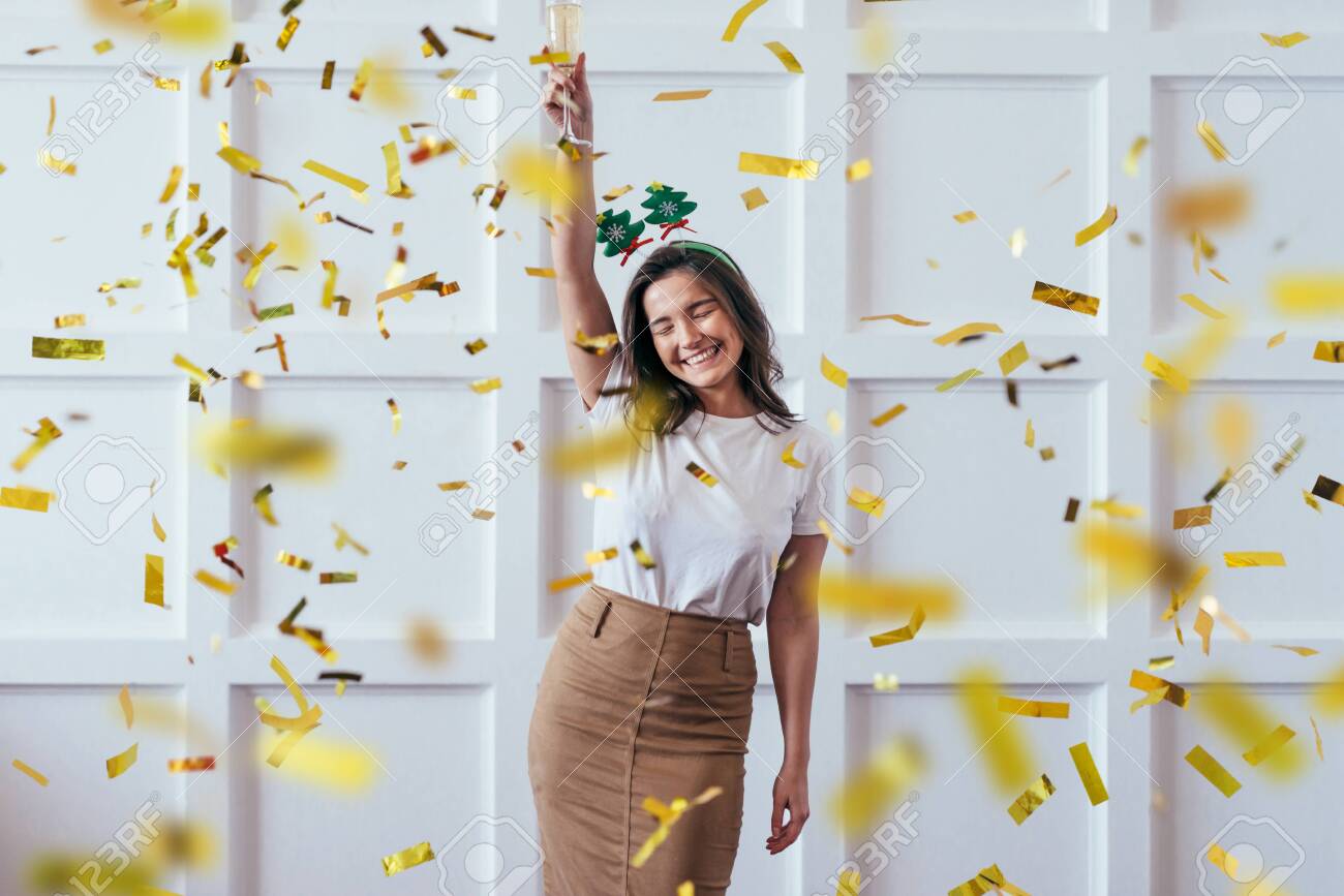 Portrait of young woman with glass celebrate Christmas or New Year - 133998167 Portrait of young woman with glass celebrate Christmas or New Year - 133998167