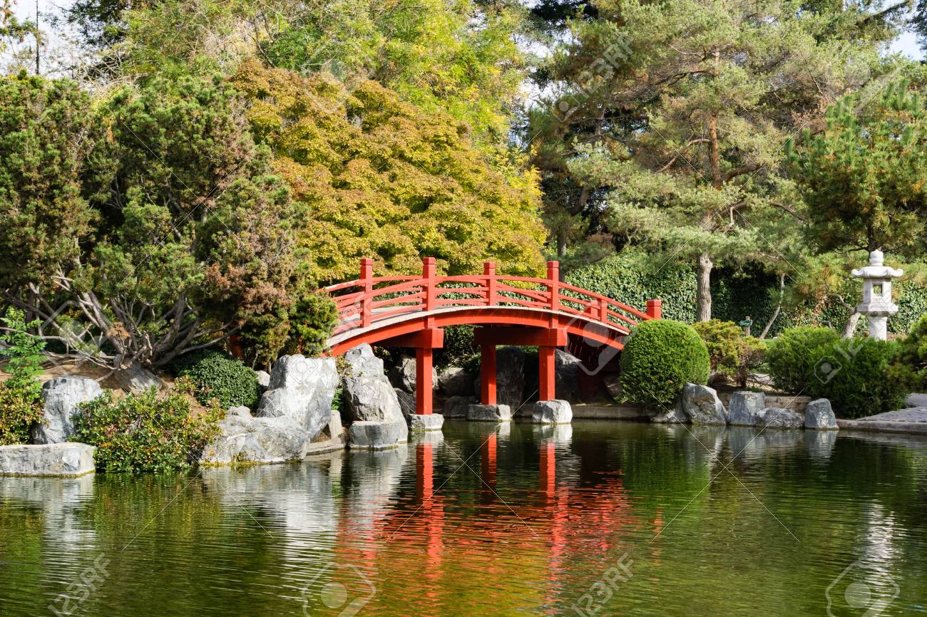 Red Bridge Over A Man Made Pond Japanese Friendship Garden