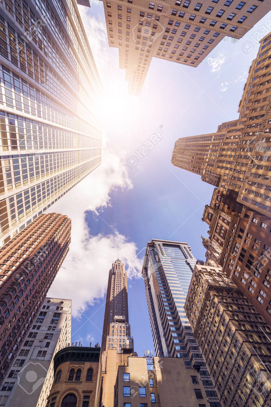 Low Angle Shot Of Futuristic Glass And Steel Office Highrise