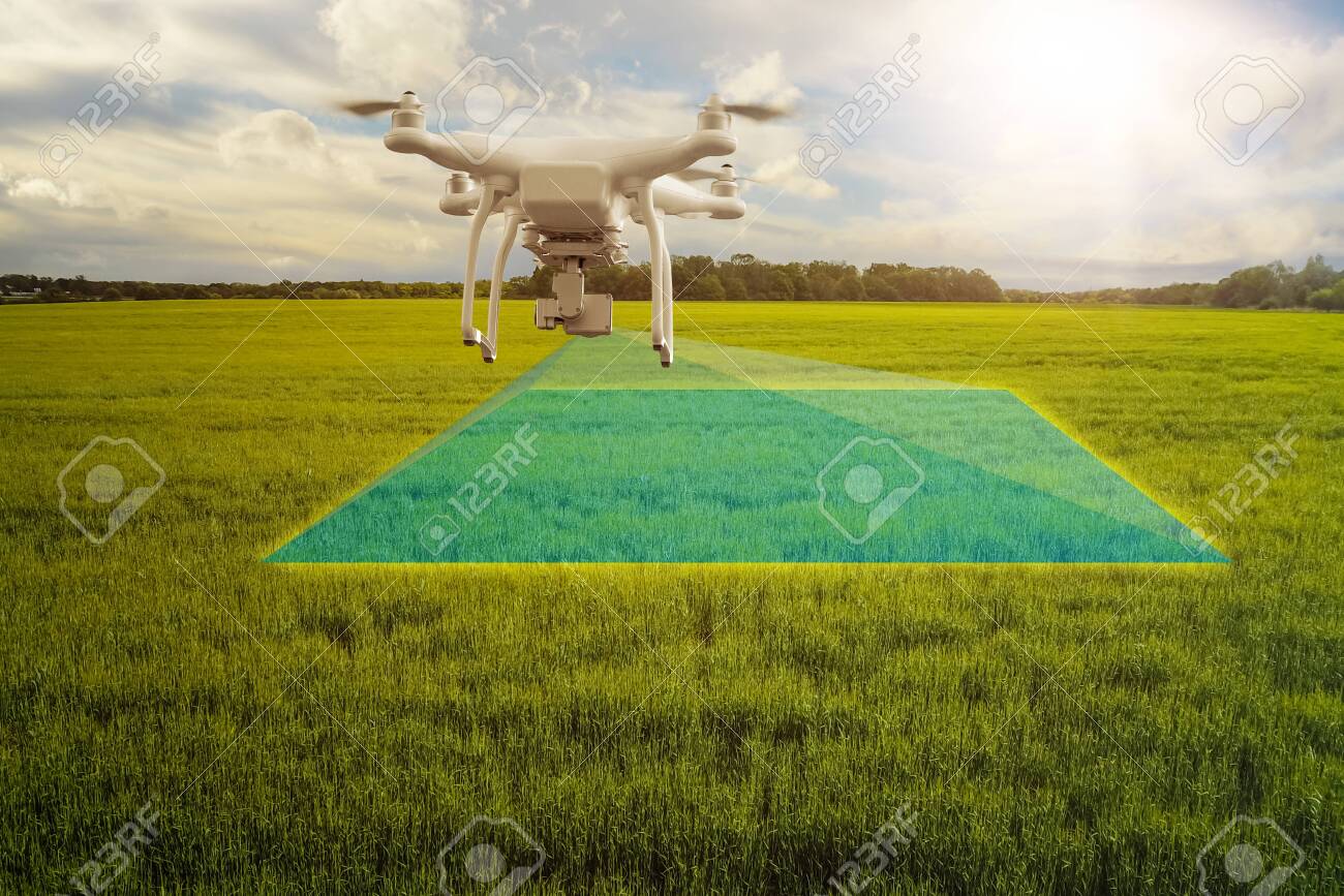 UAV drone multicopter flying with high resolution digital camera over a crops field, agriculture concept - 132166146 UAV drone multicopter flying with high resolution digital camera over a crops field, agriculture concept - 132166146