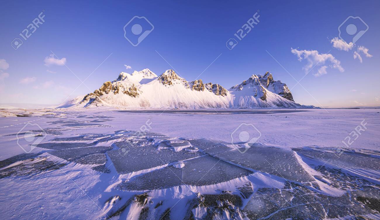 Vestrahorn Mountains on Stokksnes cape with ice floes in front, beautiful winter morning scenery, Iceland - 146361871 Vestrahorn Mountains on Stokksnes cape with ice floes in front, beautiful winter morning scenery, Iceland - 146361871