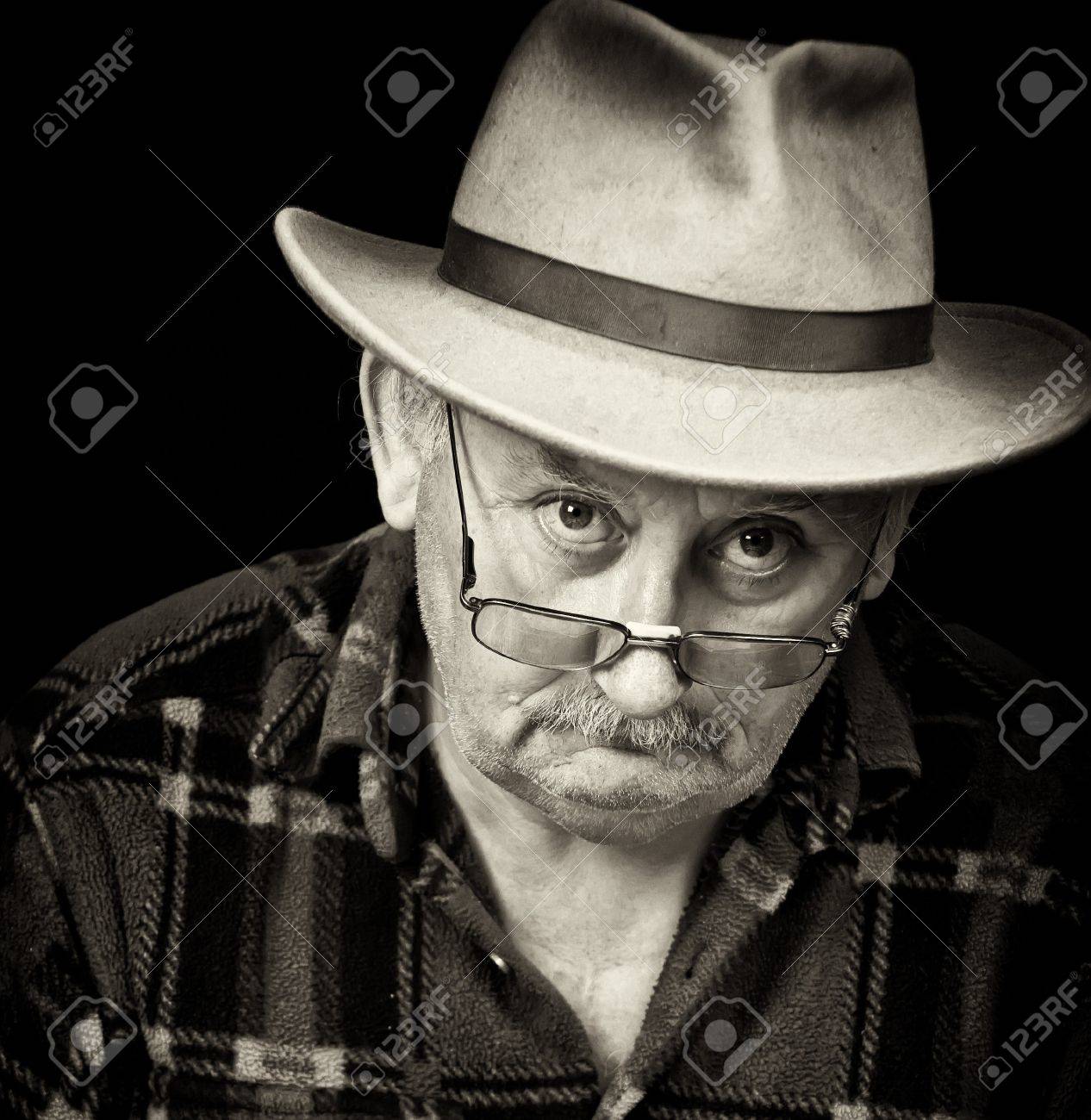 photo of senior male with sad or grumpy face portrait - 7610152 photo of senior male with sad or grumpy face portrait - 7610152