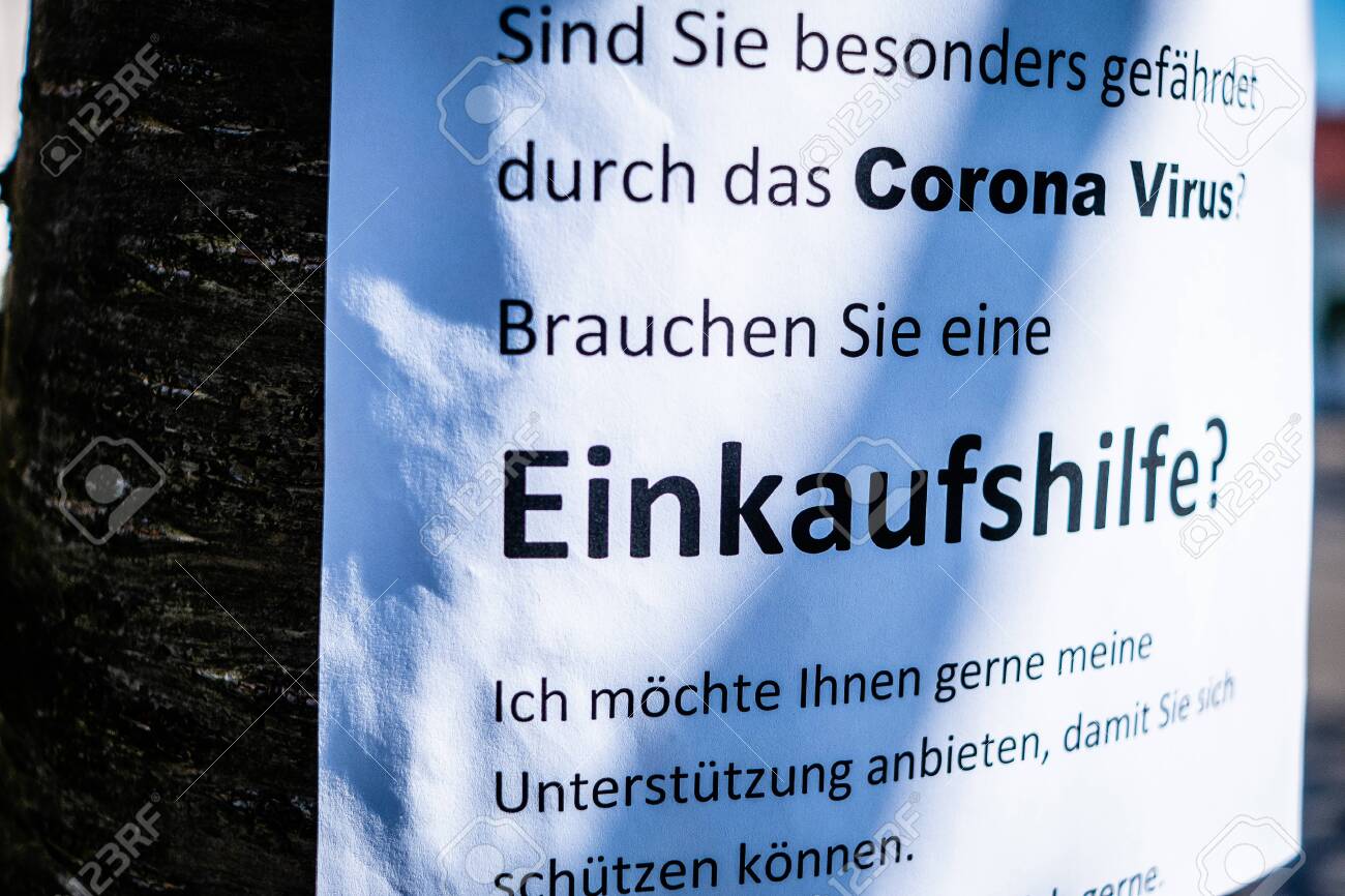 Sign on a tree that offers help for the elderly in the Corona crisis in German Einkaufshilfe für ältere Menschen die besonders gefährdet sind in English Shopping aid for older people who are particularly at risk - 144587381 Sign on a tree that offers help for the elderly in the Corona crisis in German Einkaufshilfe für ältere Menschen die besonders gefährdet sind in English Shopping aid for older people who are particularly at risk - 144587381