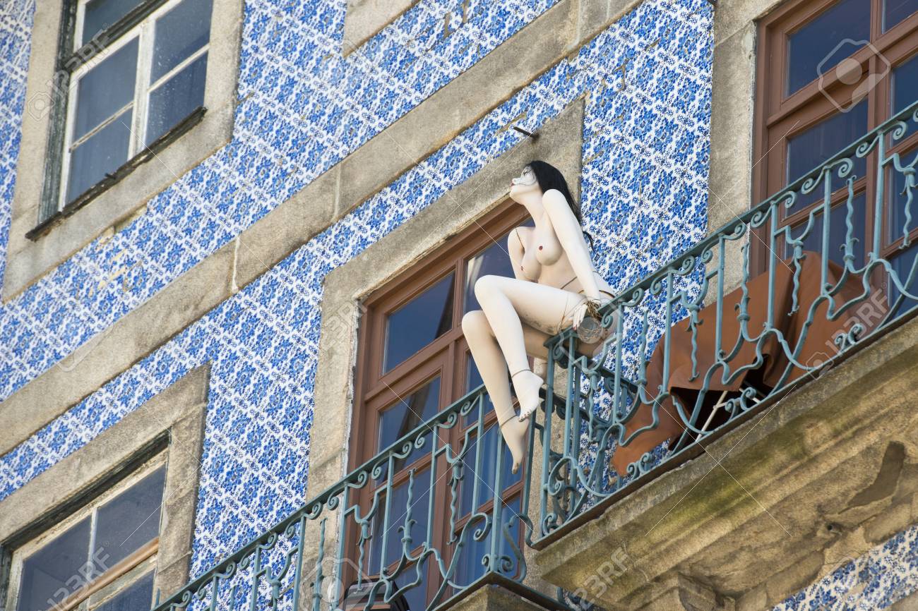 A Naket Women Pupet On A Balcony In Ribeira In The City Centre Of Porto In A Naket Women Pupet On A Balcony In Ribeira In The City Centre Of Porto In