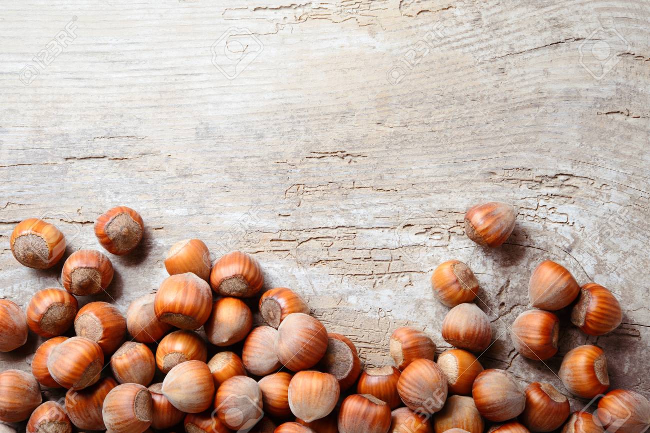Hazelnut. Fresh organic filbert. Nuts on wooden background. - 94883337 Hazelnut. Fresh organic filbert. Nuts on wooden background. - 94883337