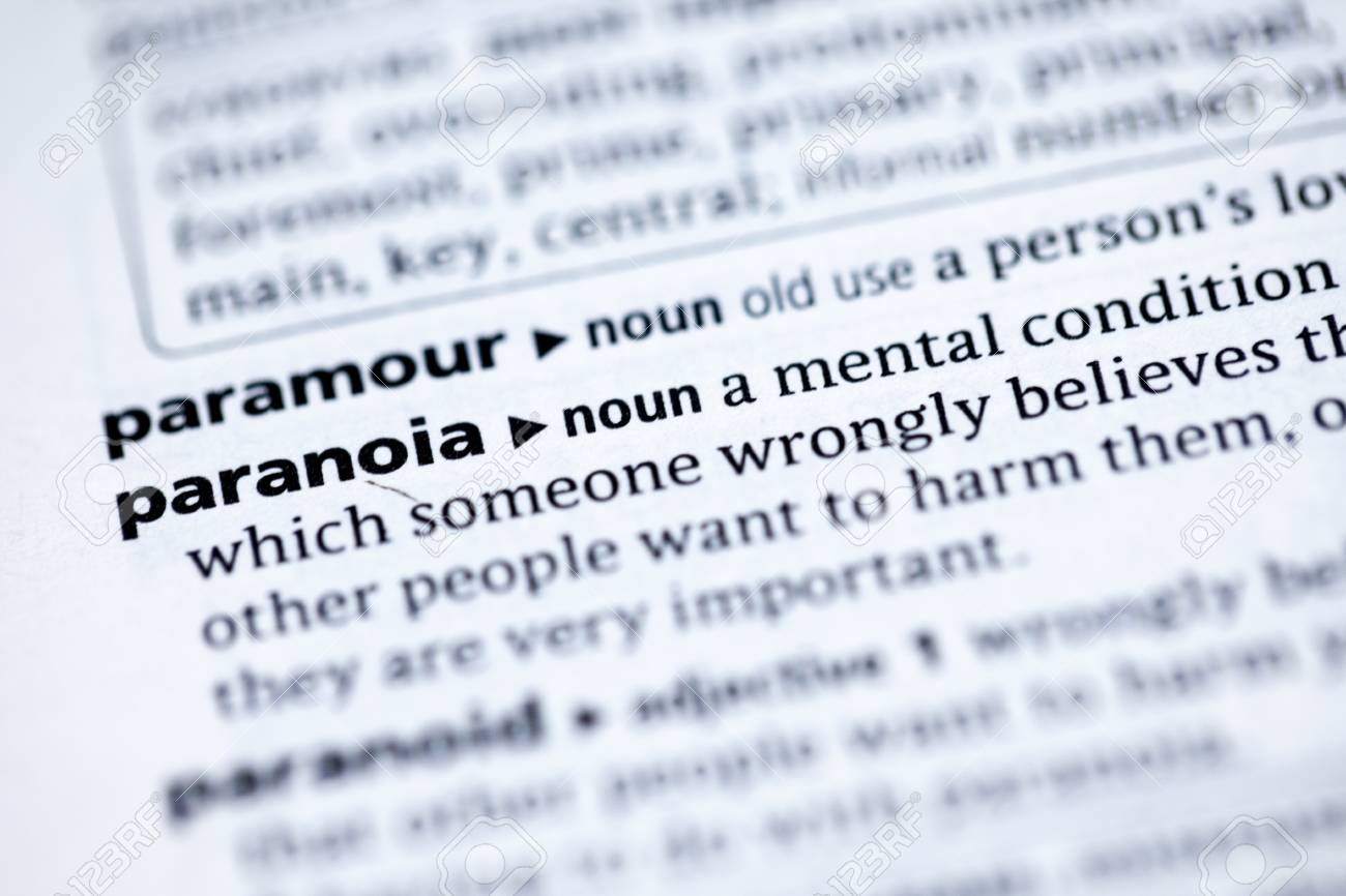 close up to the dictionary definition of paranoia stock photo