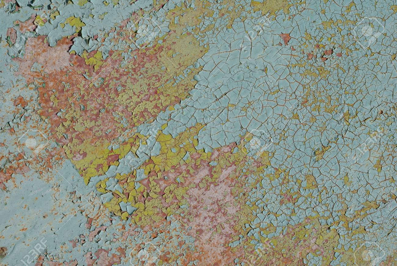 fragment of a rusty iron surface covered with old paint which old paint