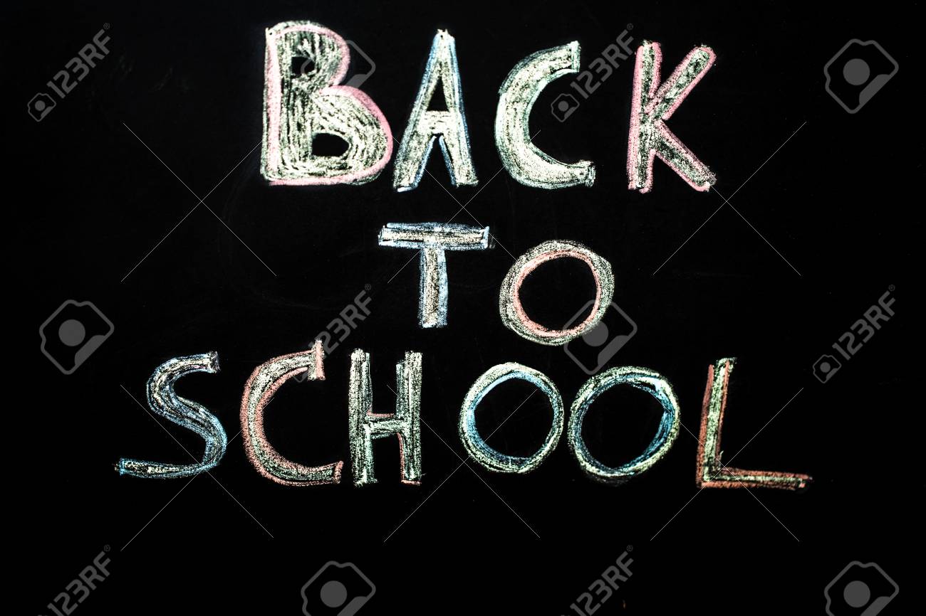 inscription in chalk back to school on black chalkboard education chalkboard education