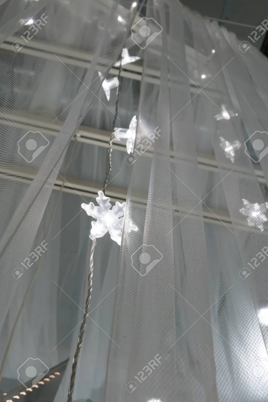 Illuminated Led Icicle Light Against Sheer Fabric Background Stock Photo Picture And Royalty Free Image Image 90705419