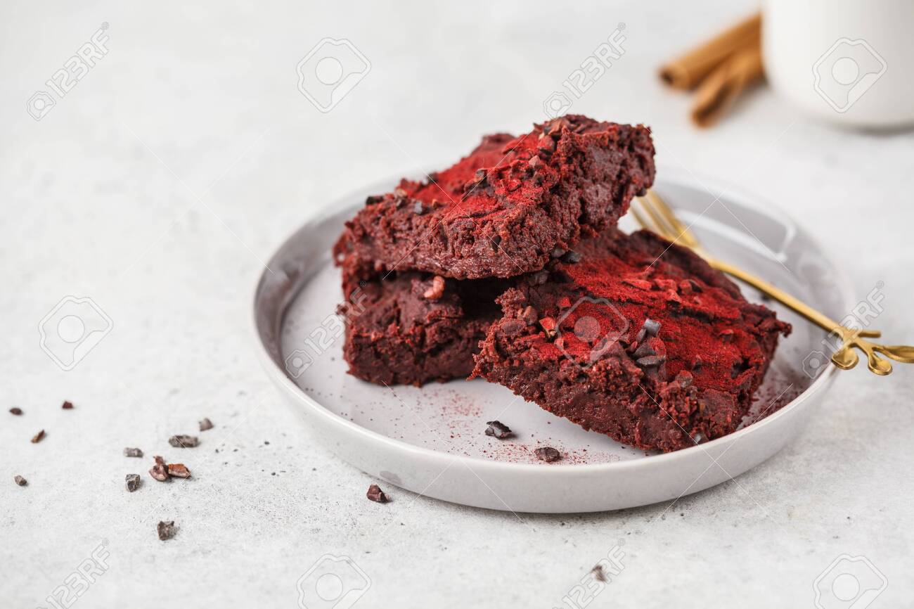Beetroot vegan brownie on gray plate. Healthy vegan food concept. - 128400745 Beetroot vegan brownie on gray plate. Healthy vegan food concept. - 128400745