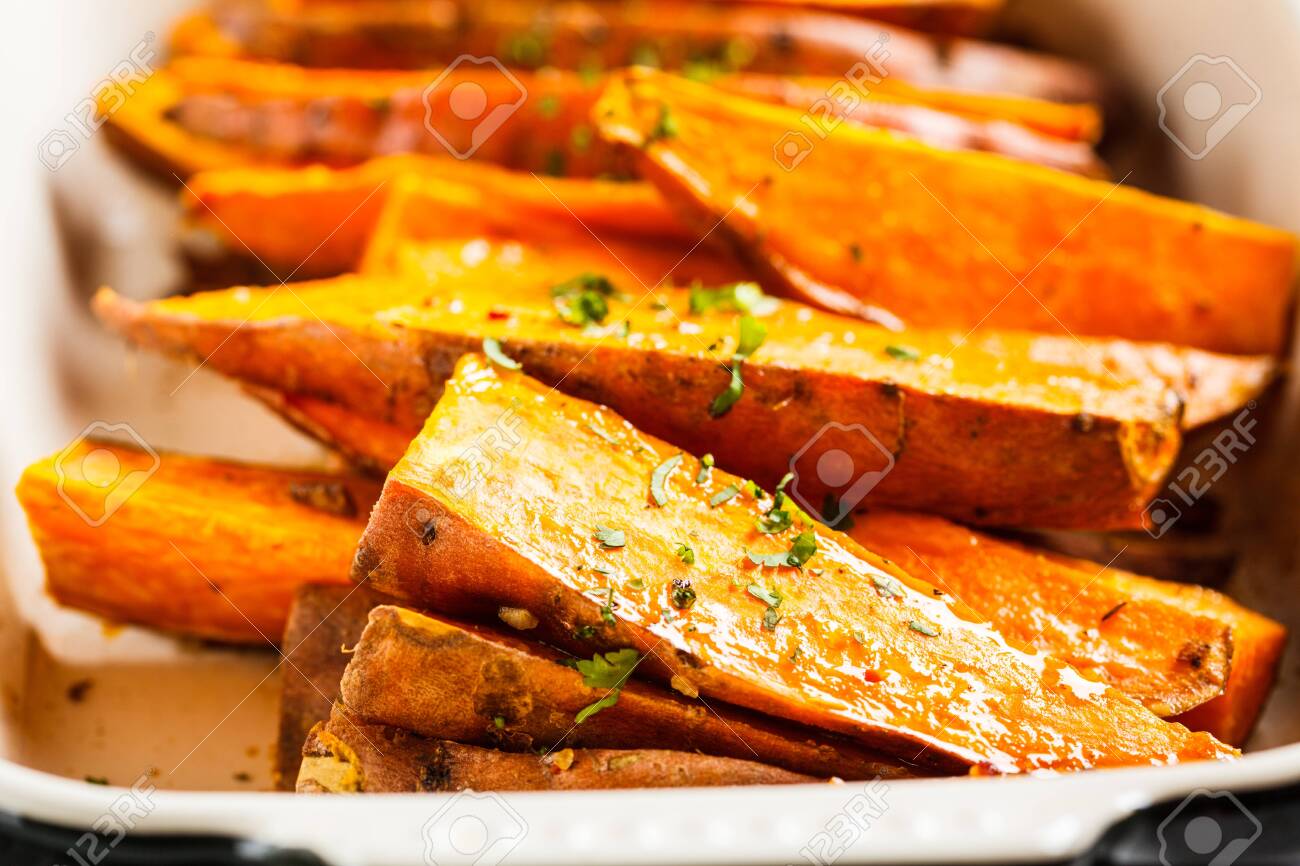 Baked Sweet Potato Slices With Spices In The Oven Dish Healthy Stock Photo Picture And Royalty Free Image Image 129419229