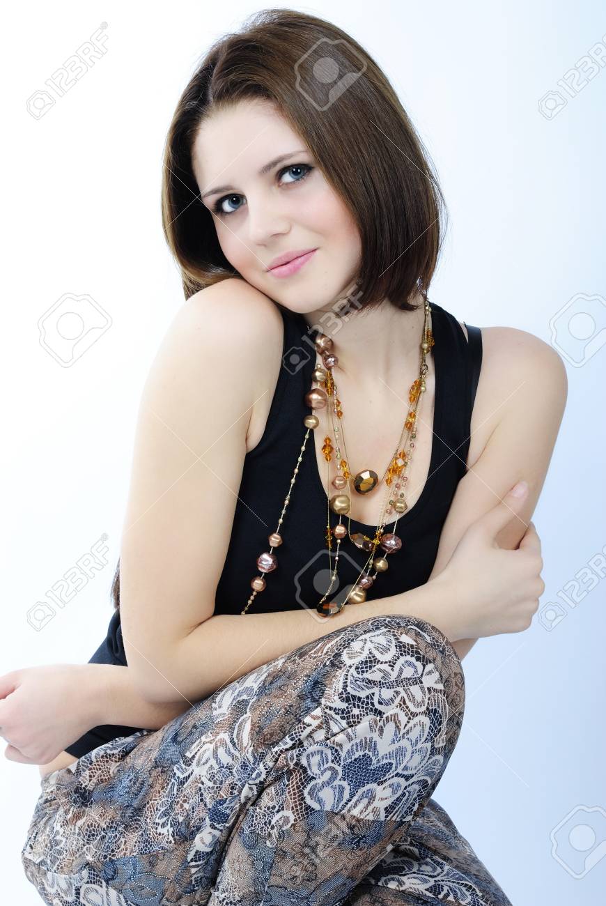 Young Beautiful Girl In Black Tanktop With Short Hair On White