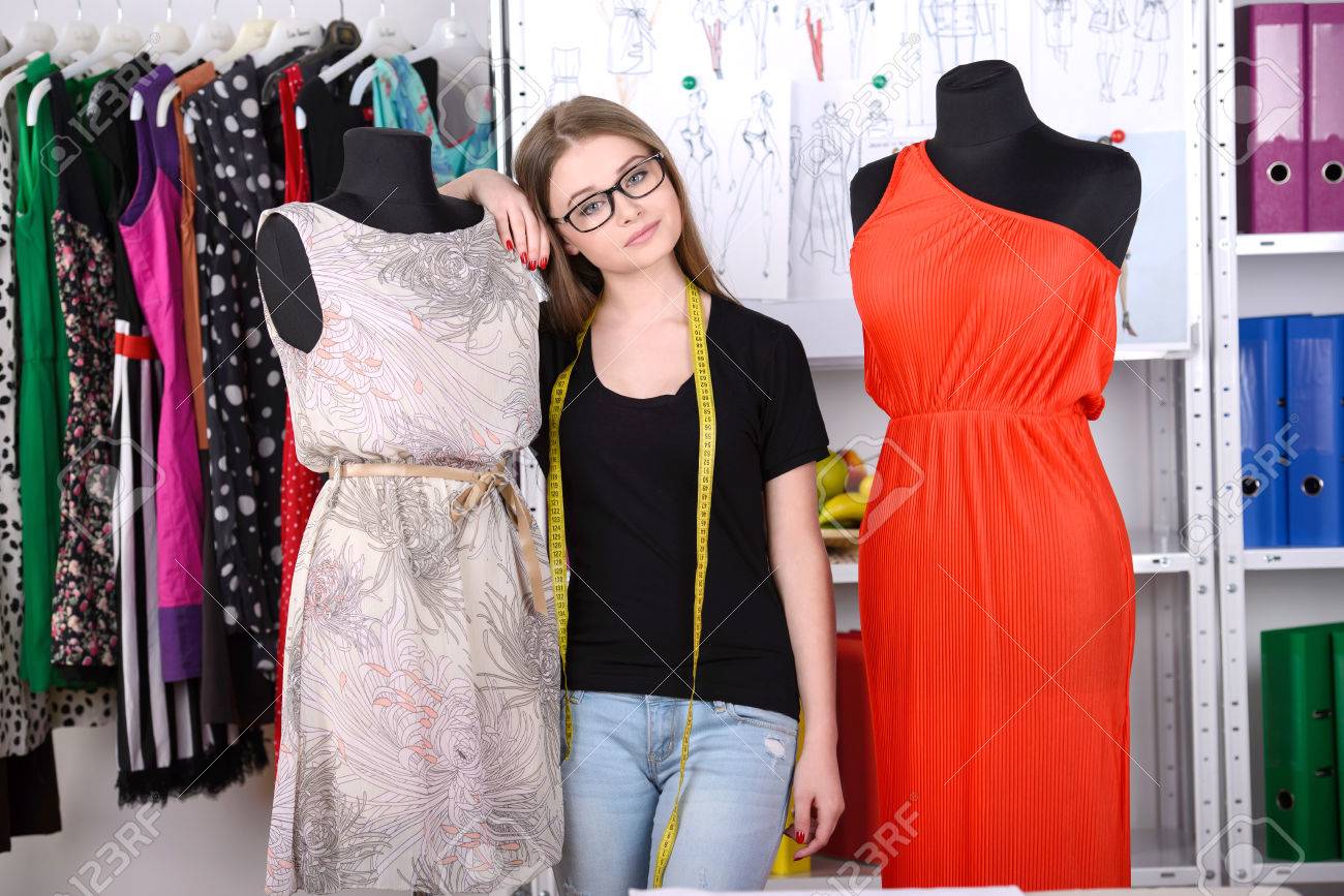 Fashion Designer At Work Beautiful Young Woman Working In Design Studio Stock Photo Fashion Designer At Work Beautiful Young Woman Working In Design Studio Stock Photo