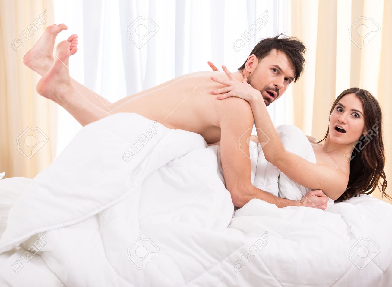 Young Love Couple In Bed Romantic Scene In Bedroom Stock Photo