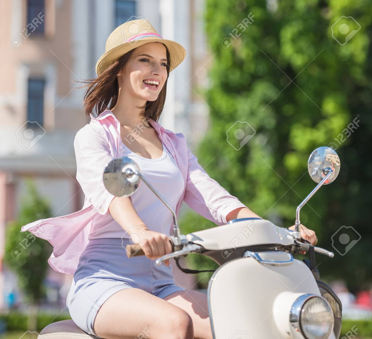girls driving scooty
