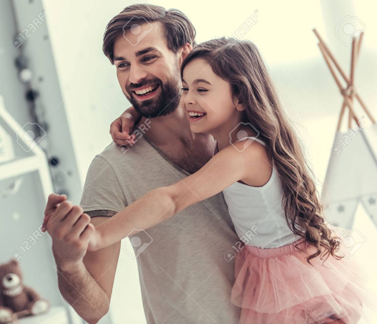 father youg daugther Cute Little Daughter And Her Handsome Young Dad Are Dancing And Smiling  While Playing Together In Child's Room Stock Photo, Picture and Royalty  Free Image. Image 81786821.