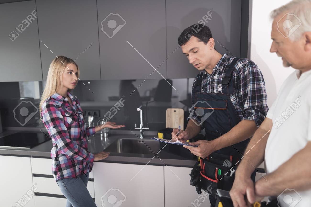 The Woman Called Two Plumbers To Repair The Kitchen Sink The Men Brought With Them All Tools In The Black Tool Boxes Stock Photo Picture And Royalty Free Image Image 89941494